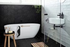 13 black hexagon tiles with white grout and white subway tiles create a bold contrasting look