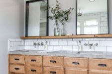 15 white subway tiles with black grout, a concrete countertop and a plywood vanity with drawers