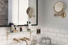 16 a vintage-inspired sink space with white subway tiles and black grout, marble countertops plus brass touches