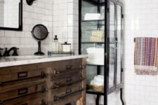 19 a vintage-inspired bathroom with white subway tiles and black grout plus black accessories