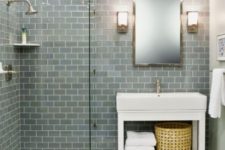 22 grey and slate subway tiles contrast marble floor tiles and create a chic and welcoming bathroom space