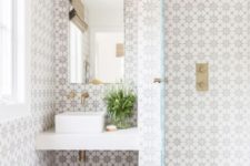24 chic patterned mosaic tiles on the walls and neutral light grey ones on the floor