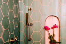 26 green hex tiles paired with copper grout and copper fixtures are a chic and bold idea wiht a refined touch