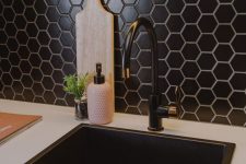a beautiful and textural black hex tile backsplash will add chic and elegance to the kitchen, and a black sink and fixtures echo with it