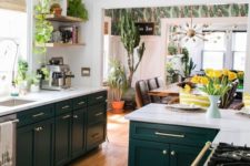 a bright boho kitchen with a colorful boho rug, potted greenery and cacti and some mid-century modern items