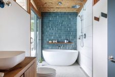 a stylish bathroom with a cozy wooden ceiling