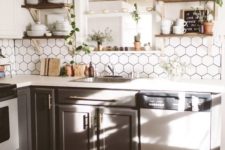 a neutral boho chic kitchen with a hex tile backsplash, a boho rug, potted greenery and open wooden shelving