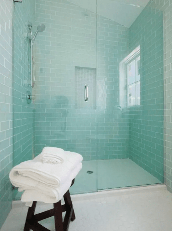accent your shower space with mint-colored subway tiles, which raise the spirits and add color to the space