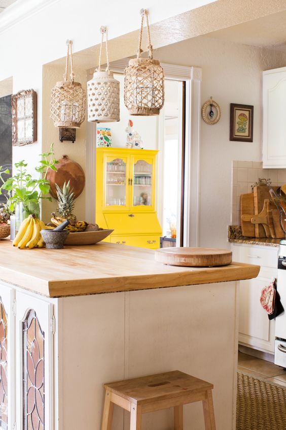 macrame lantern holders, a jute rug and wooden touches will make your simple and neutral kitchen feel boho at once