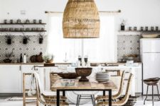 mosaic tiles, a boho rug, a wicker lampshade and chairs make up a nice boho tropical kitchen in neutrals