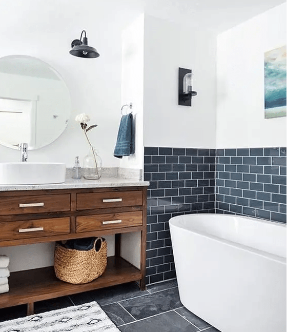 navy subway tiles are an unusual choice, and paired with stained wood and whites they look especially cool