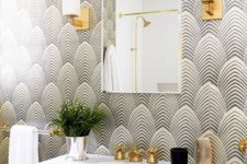 03 art deco wallpaper and brass touches make the bathroom super chic and refined