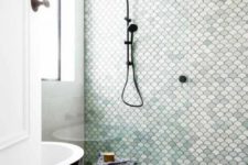 04 a simple shower is made cooler with aqua-colored, white and blush fishscale tiles that mismatch in color but match in shape