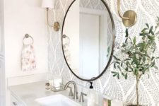 07 a chic farmhouse bathroom done in neutrals, with printed wallpaper, a stone countertop and touches of brass and gold