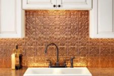 09 hammered copper tiles bring a cool Moroccan feel to tthe super neutral white kitchen
