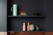 11 copper tiles contrast minimalist matte black cabinets and add a shiny and super sytlish touch