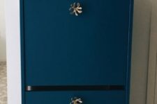 13 a bold blue IKEA Bissa cabinet with catchy brass knobs looks really expensive and very whimsy thanks to knobs