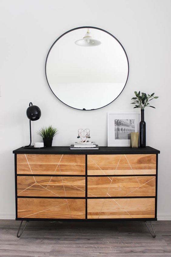 a contemporary Tarva hack with black paint, light colored stain, a geometric pattern and hairpin legs