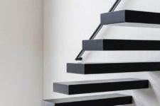 14 blackened metal floating stairs will perfectly fit a minimalist space and make a statement with color