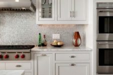 15 a shiny silver tile backsplash to spruce up a neutral kitchen with white cabinets