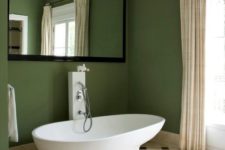 15 a whimsy mid-century modern bathroom with a large mirror over the bathtub for a catchy look