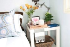 16 a stylish and functional nightstand of a couple of IKEA Lack tables is an easy DIY with much open storage space
