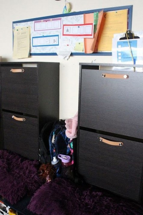 dark stained IKEA Bissa cabinets with leather pulls are a nice fit for a dark interior and they look chic and expensive