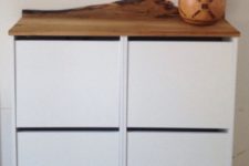 20 IKEA Bissa hack with a wooden living edge countertop, which is a trendy and edgy idea to go for