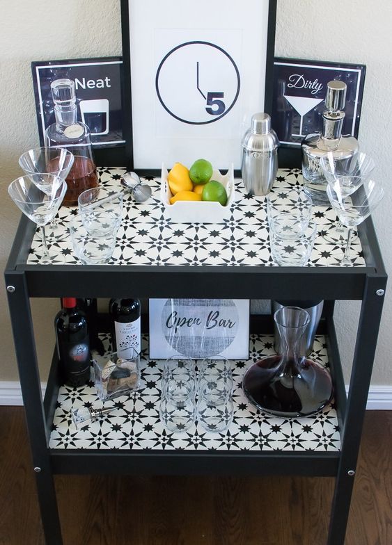 a stylish monochromatic bar made of an IKEA Sniglar changing table spruced up with mosaic tiles