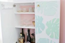 21 an IKEA Ivar cabinet turned into a stylish kid-proof home bar with 3D tropical leaves and pink backing inside