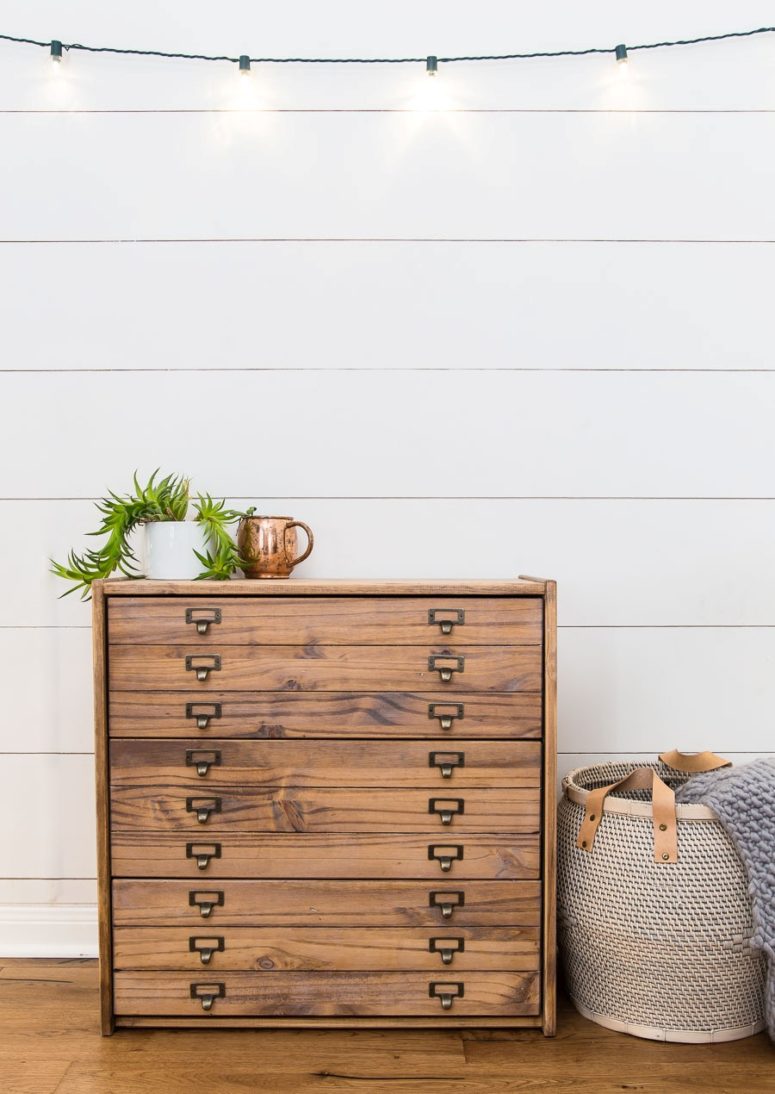 an IKEA Rast dresser with library pulls and a faux drawer front for a retro feel in your space