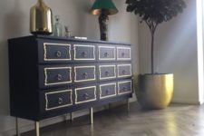 25 IKEA Malm hack in navy, with yellow drawer trim, ring pulls and brass legs for a touch of vintage elegance