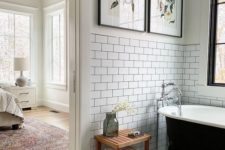 26 a monochromatic bathroom with avintage touch and bright botanica artworks reminding of vintage posters