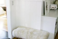 a comfy furry ottoman made of a bench and an IKEA faux fur rug in white is a cool glam idea