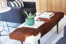 a stylish ottoman reupholstered with an IKEA Koldby Cowhide for mid-century modern space