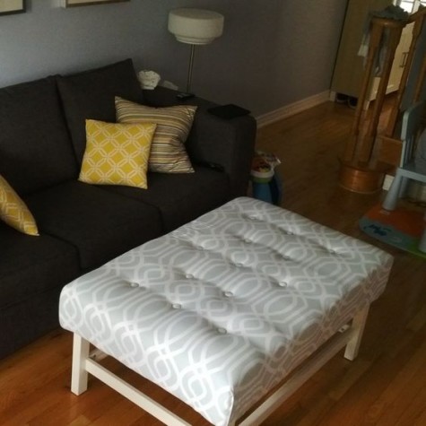 an IKEA Hemnes coffee table renovated into a stylish and simple upholstered ottoman