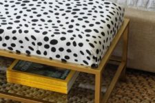 an IKEA Vittsjo table hacked into a chic ottoman with a soft cushion and animal printed fabric on top