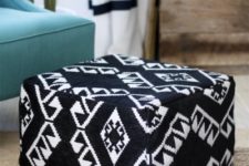 an IKEA footstool turned into a comfy boho folksy pouf in black and white with patterns