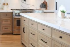 02 a modern farmhouse kitchen spruced up with black hardware for a more modern feel
