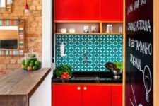 03 a bright red kitchen with black countertops and a bold turquoise tile backsplash looks like a super bold splash of color