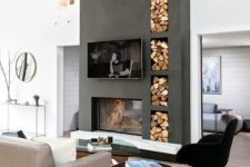 03 a contemporary living room finished off with a concrete clad fireplace and built-in firewood storage in the same unit