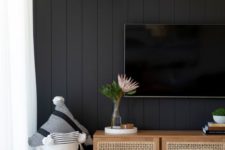 07 a black accent wall done with shiplap will make any contemporary living room stylish and very chic
