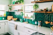 08 a neutral contemporary kitchen with a green brick backsplash that adds shine and color to the space