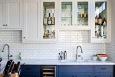 14 bold blue and white cabinets plus a white subway tile backsplash for a cool look with a touch of retro