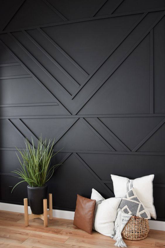 a black paneled accent wall is a great statement in your living room or bedroom, it will texture