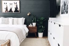 17 a statement wall done with black shiplap is a chic idea for a boho or rustic bedroom, and the texture is cool
