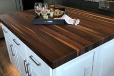 17 a stylish dark stained butcher block kitchen countertop looks wow and contrasts the neutral island