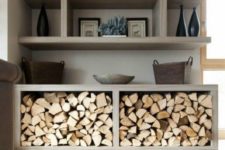 19 an open shelving unit to store firewood makes it fit even a minimalist space and look very clean and sleek