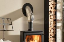 21 a stylish metal firewood stand that matches the fireplace – place your fireplace right on it for more comfort