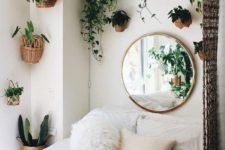 21 greenery in pots attached to the walls is ideal for this small boho bedroom